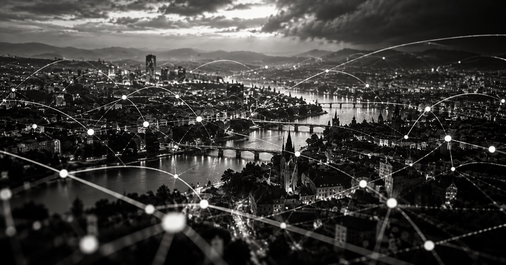 Schwarz-Weiss-Ansicht einer Stadt mit einem komplexen Netzwerk aus digitalen Verbindungen und Knotenpunkten.